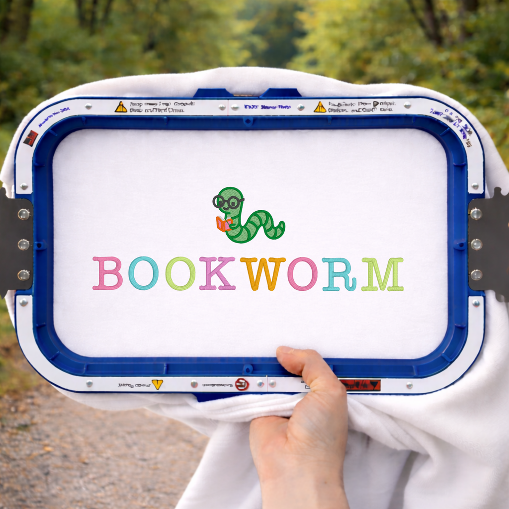 Sweatshirt with 'BOOKWORM' text and worm icon held by a person outdoors.